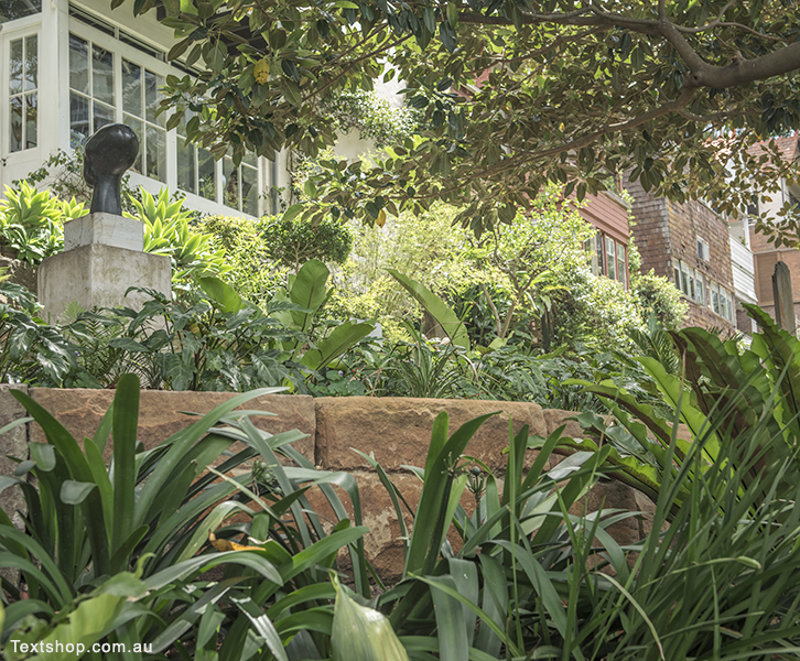 Row of historic houses looking over Wendy's Secret Garden and Lavender Bay.