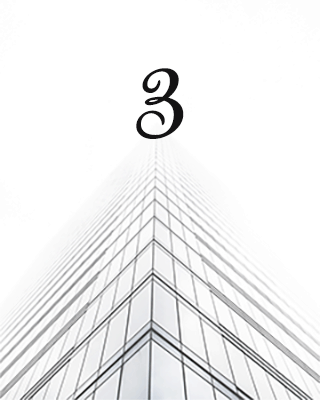Figure number 3 above a highrise building showing third tip in annual report writing tips