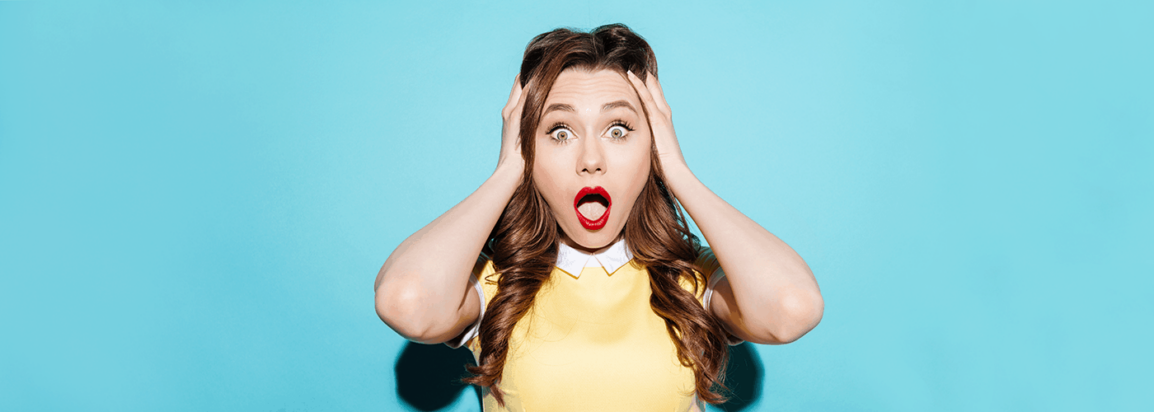 Woman reacting with shock to common errors every writer should know about