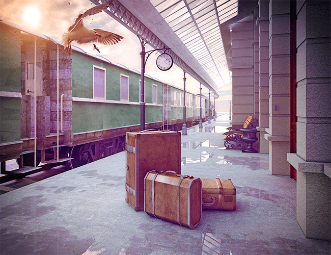 Train station in Europe with suitcases on the platform and a train waiting.